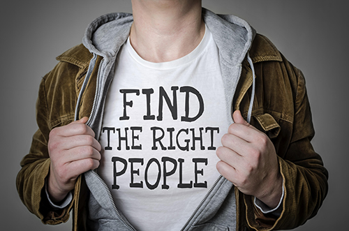 Man showing Find the right people tittle on t-shirt. Human resources, partnership, choosing partner concept.